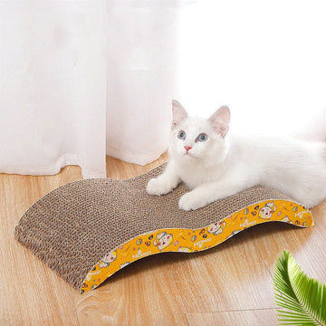 Cardboard cat scratcher sofa bed by Mon ami à quatre pattes, showing a cozy, foldable furniture piece for cats with scratching surfaces.