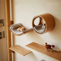 Wall mounted wooden cat shelves by Mon ami à quatre pattes, showing multiple levels and natural wood finish for cats to perch.