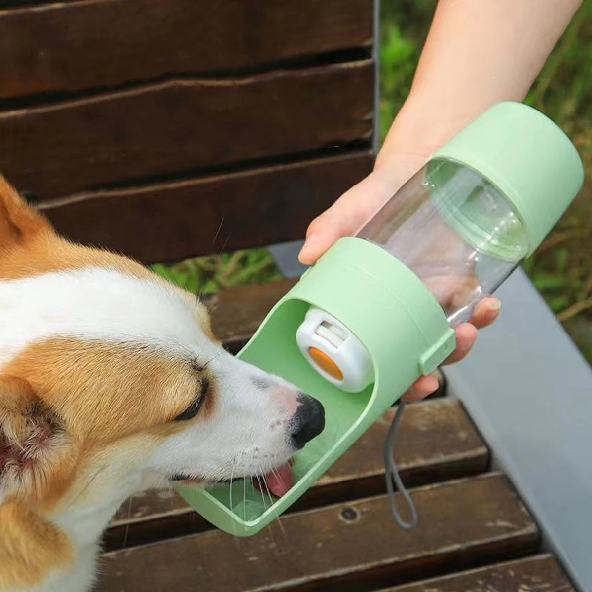 Portable dog water bottle with food container by Mon ami à quatre pattes, featuring a compact design and easy-to-use spout.