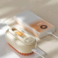 Mon ami à quatre pattes 3-in-1 electric pet steam brush showing the device with steam nozzle and pet grooming features.