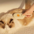 Mon ami à quatre pattes 3-in-1 electric pet steam brush with handle and steam vents, designed for grooming pets effectively.