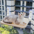 Wall mounted cat hammock window bed by Mon ami à quatre pattes, showing a cozy hammock attached to a window frame for cats.
