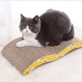 Cardboard cat scratcher sofa bed by Mon ami à quatre pattes, showing a cozy, foldable scratching and resting surface for cats.